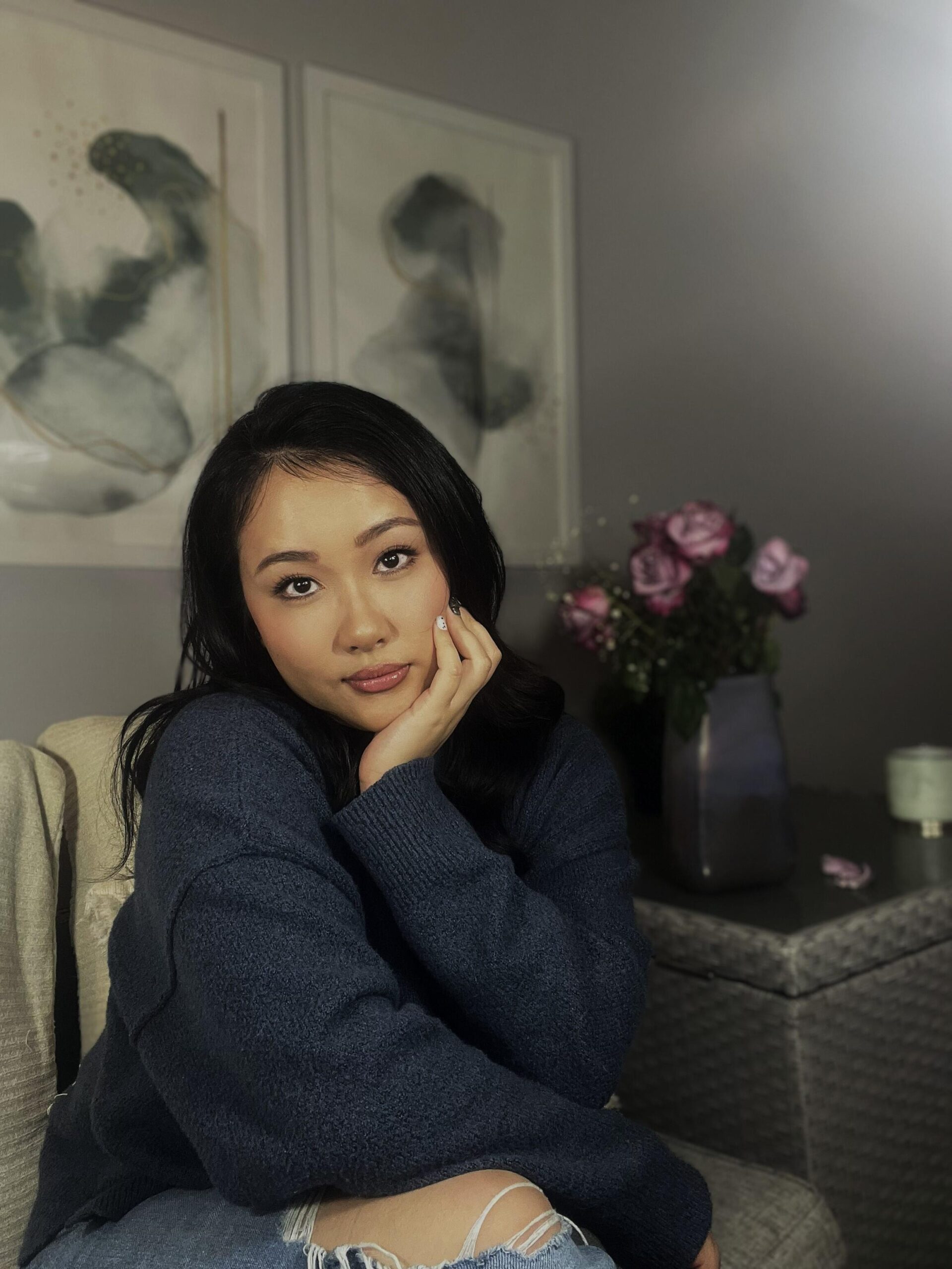 Bear Dogs - The Akita author sitting on a grey sofa.